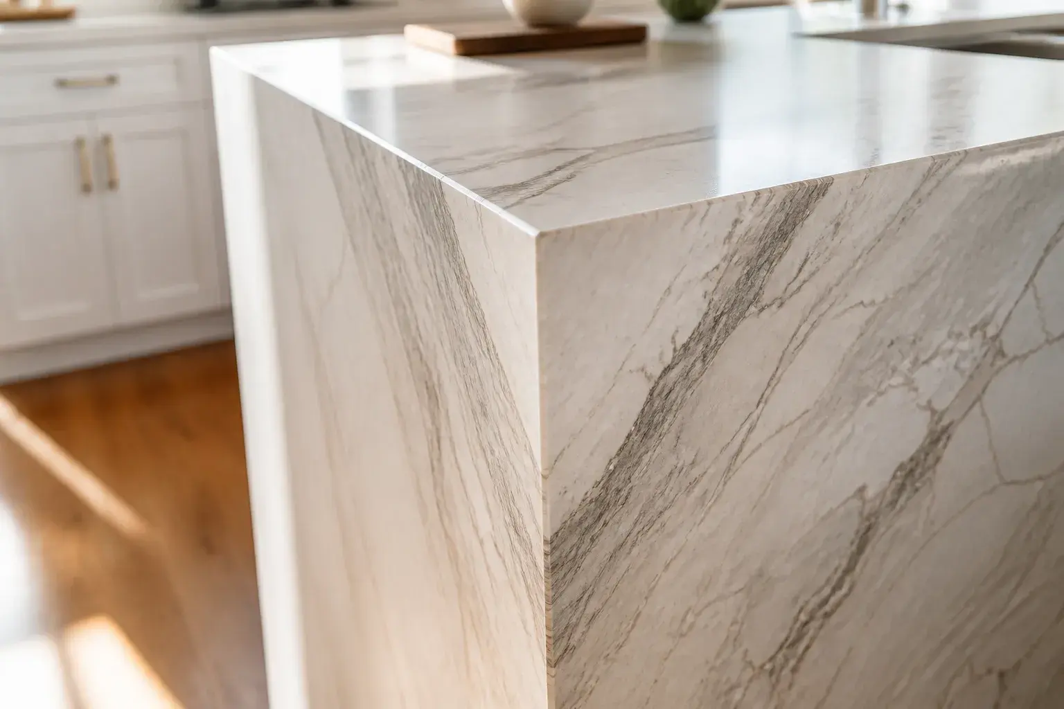 Mitered waterfall countertop corner with the veining carried down the miter to the floor.